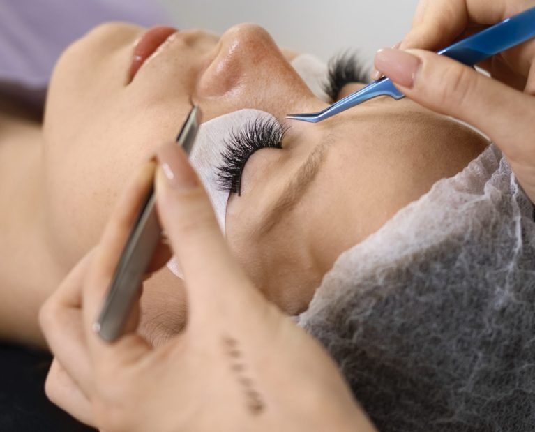 woman-wearing-eye-patches-high-angle